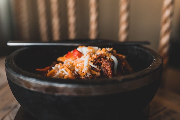 Cooked food on black bowl