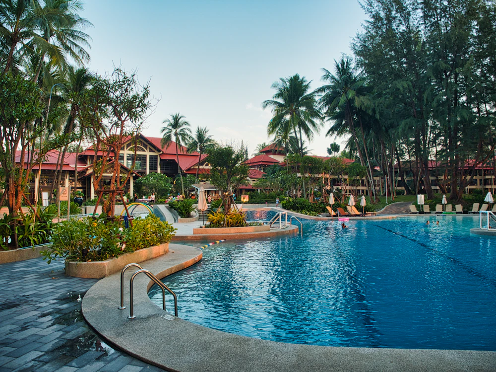Palm-lined thermal pool at a tropical resort