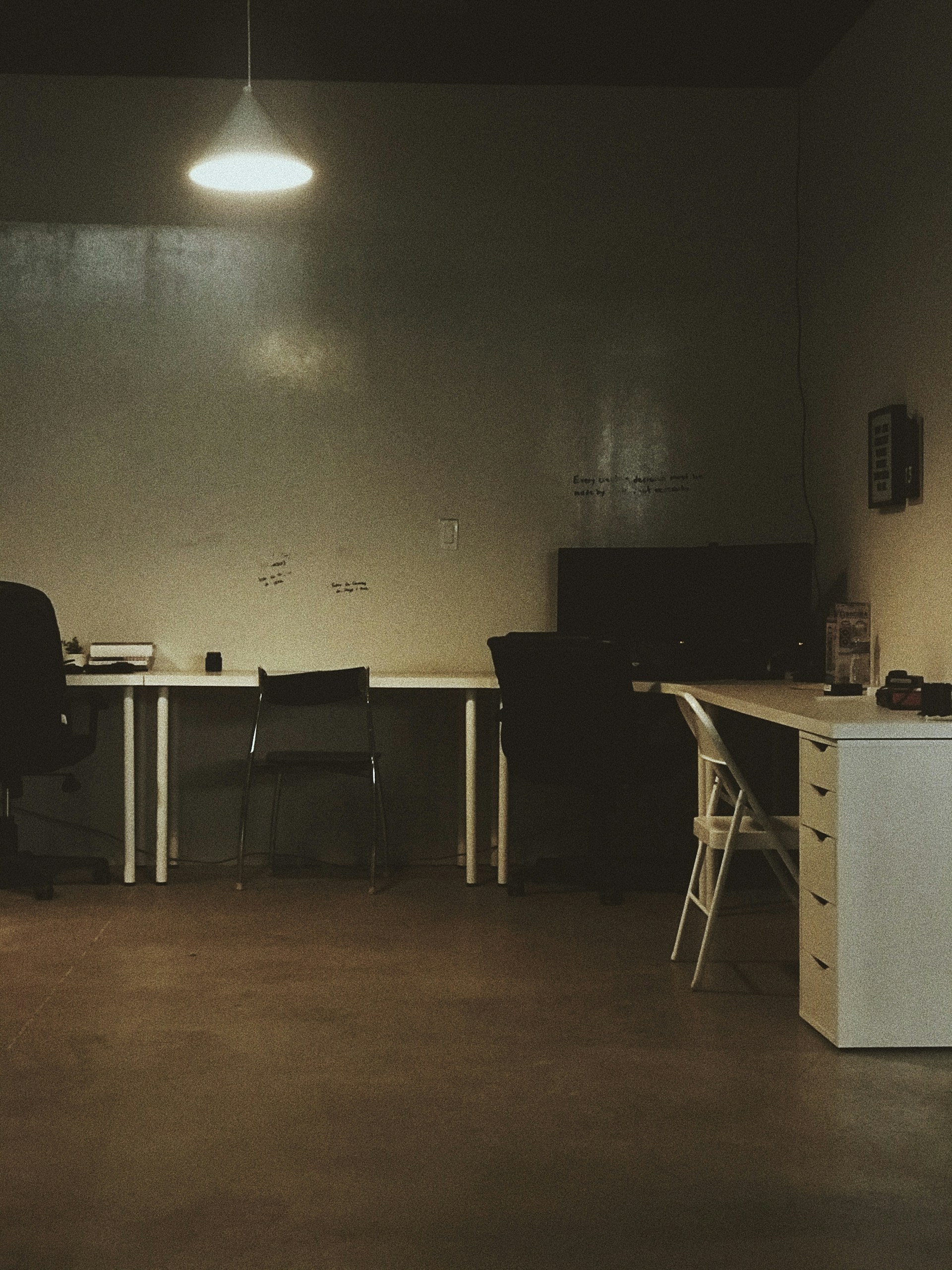 black and gray chair beside white table