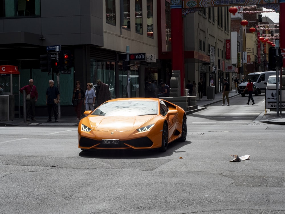 yellow porsche 911 on road during daytime