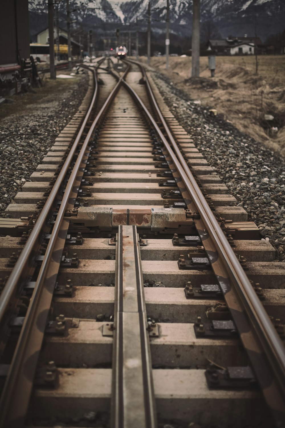 brown train rail during daytime