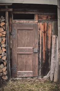 brown wooden door with brown brick wall