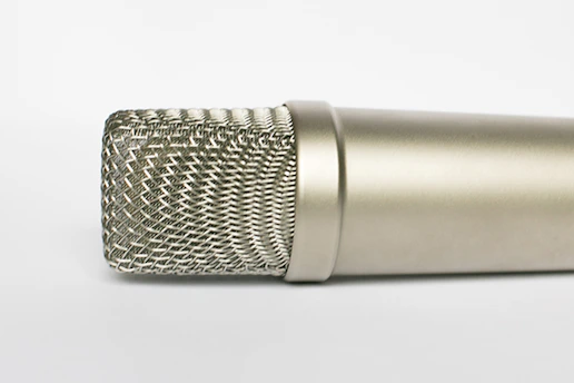 A sleek, photorealistic 3D render of a modern studio microphone showcasing refined details and subtle lighting.