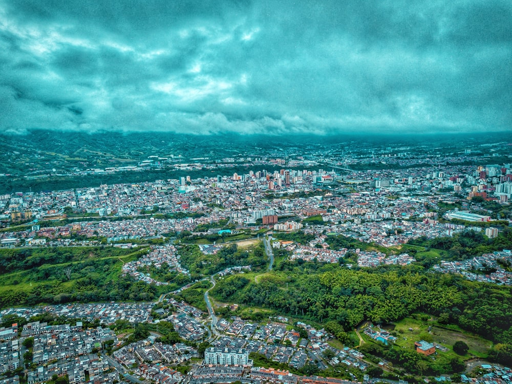 aerial view of city under cloudy sky during daytime