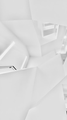 white concrete building in grayscale photography
