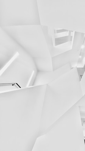 white concrete building in grayscale photography