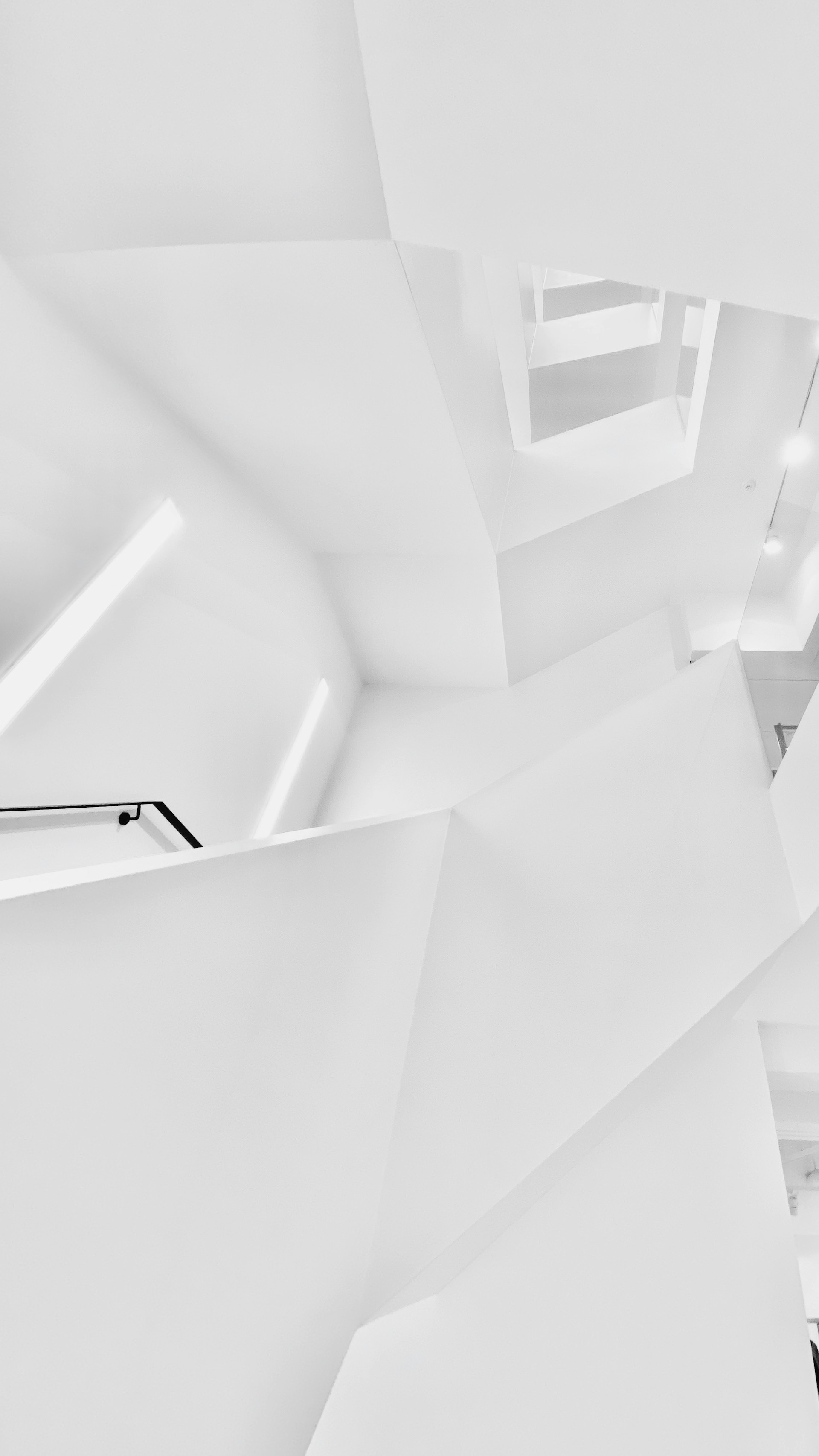 white concrete building in grayscale photography