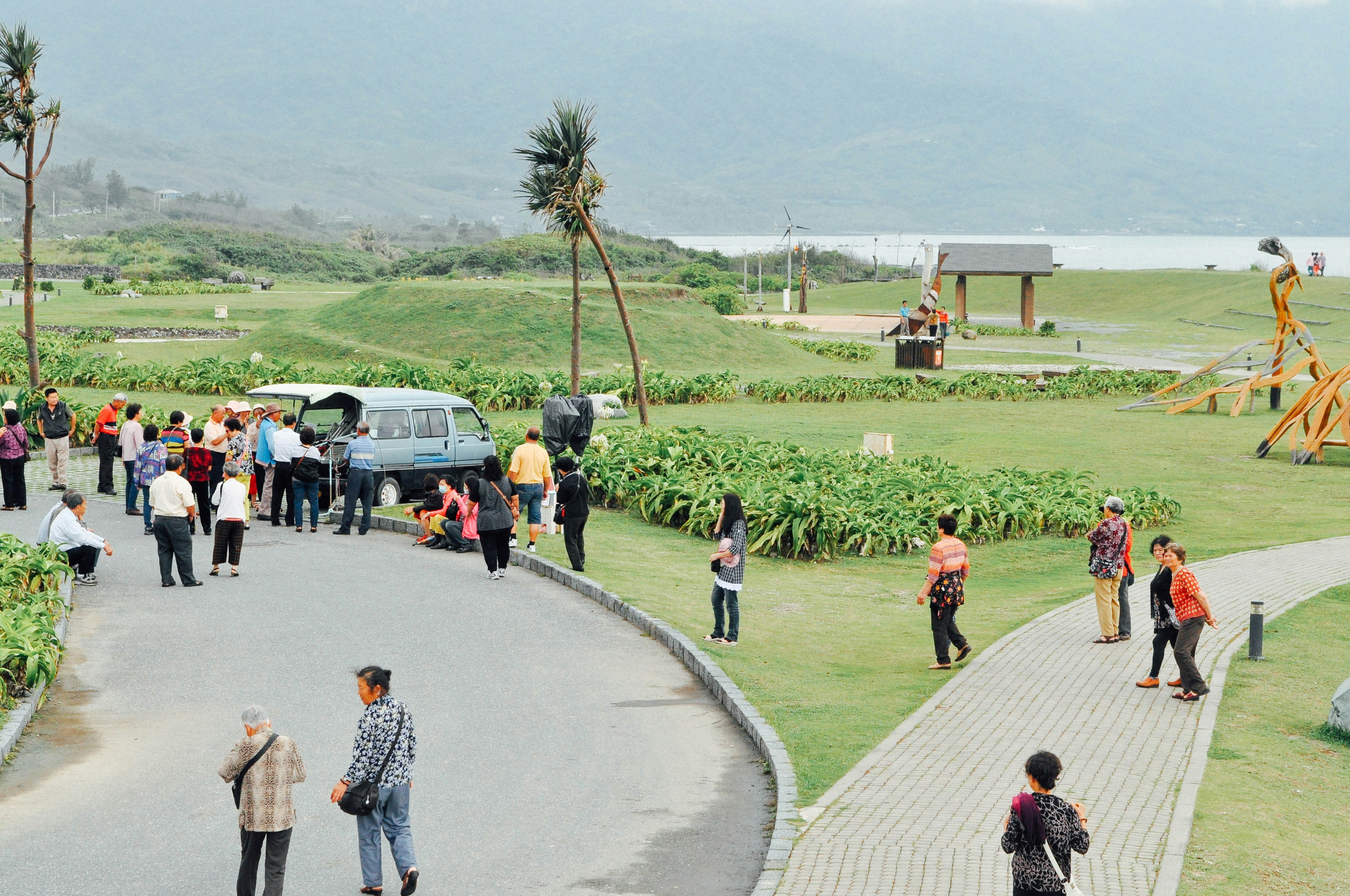 people walking on pathway during daytime