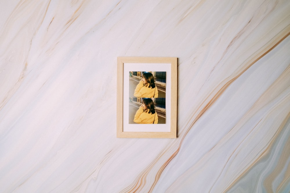 white framed photo of man and woman