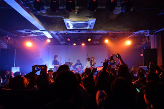a group of people standing on top of a stage