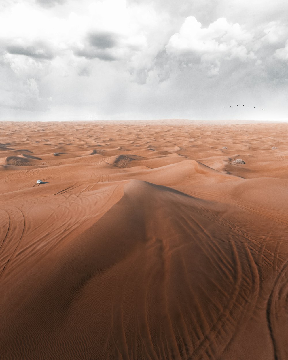 brown sand under cloudy sky during daytime