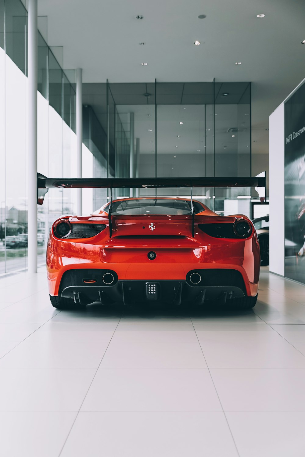 red ferrari 458 italia parked inside building