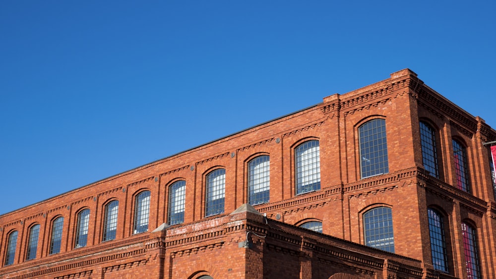 brown concrete building under blue sky during daytime