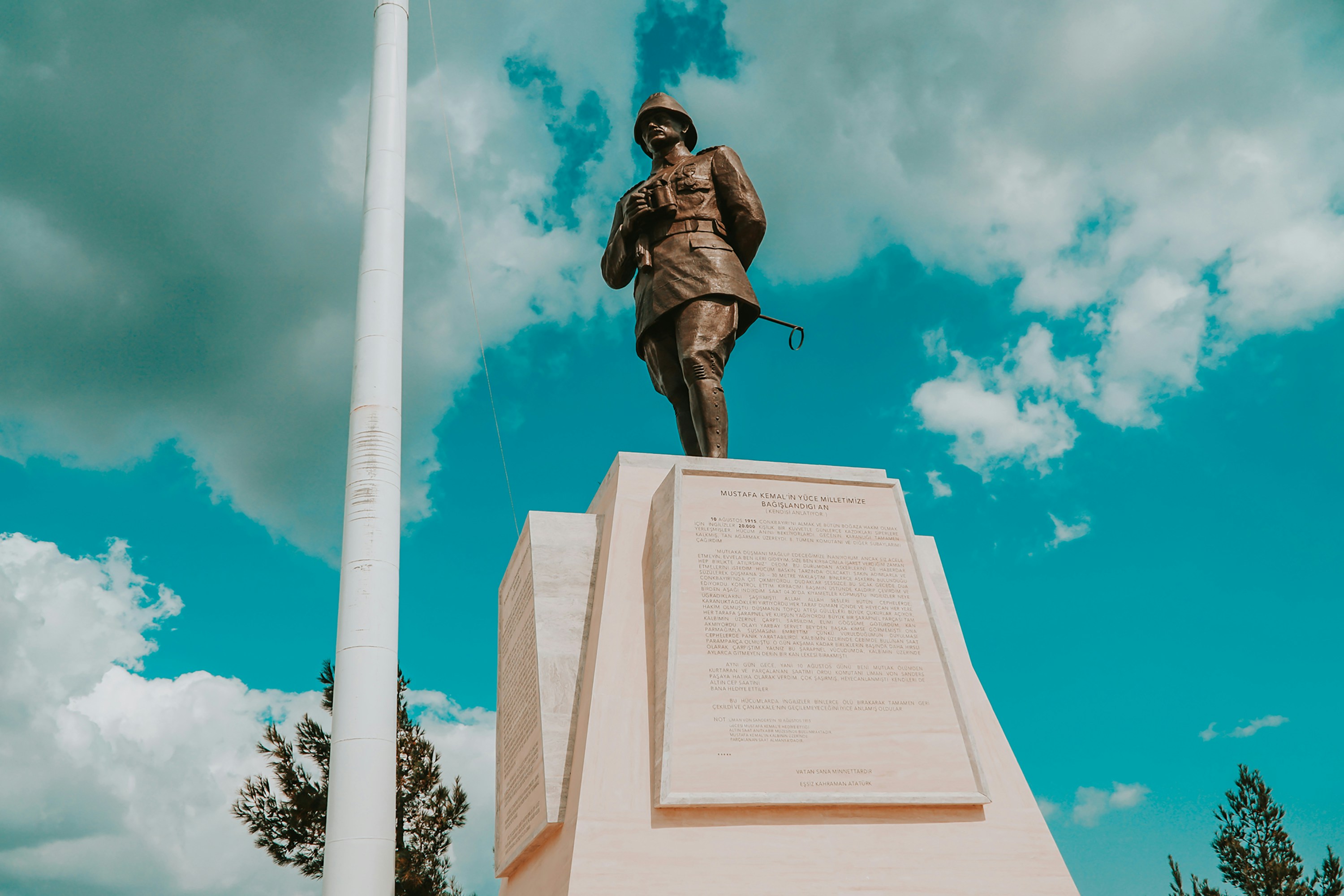 man riding horse statue under blue sky during daytime