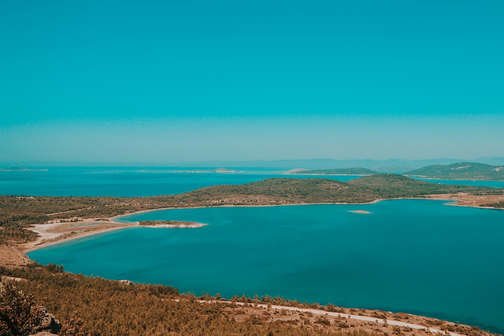 blue body of water under blue sky during daytime