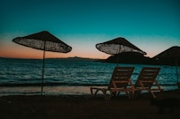 brown wooden chair on beach during daytime