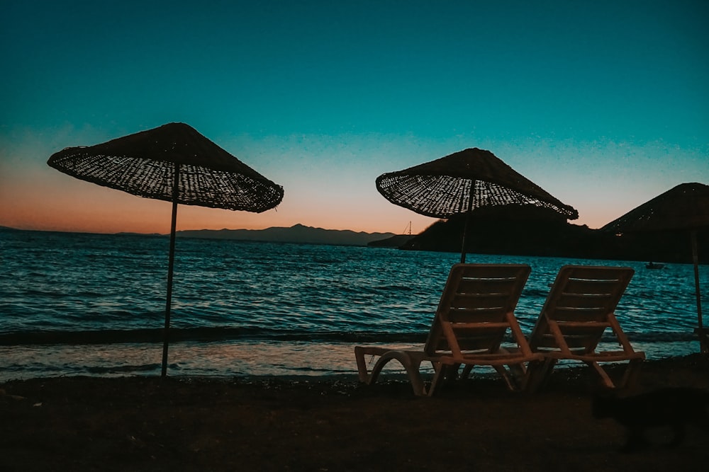 brown wooden chair on beach during daytime