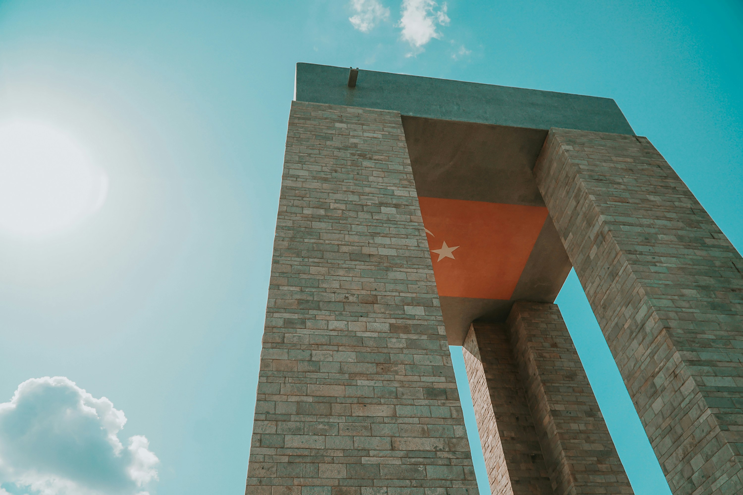 brown brick building under blue sky during daytime