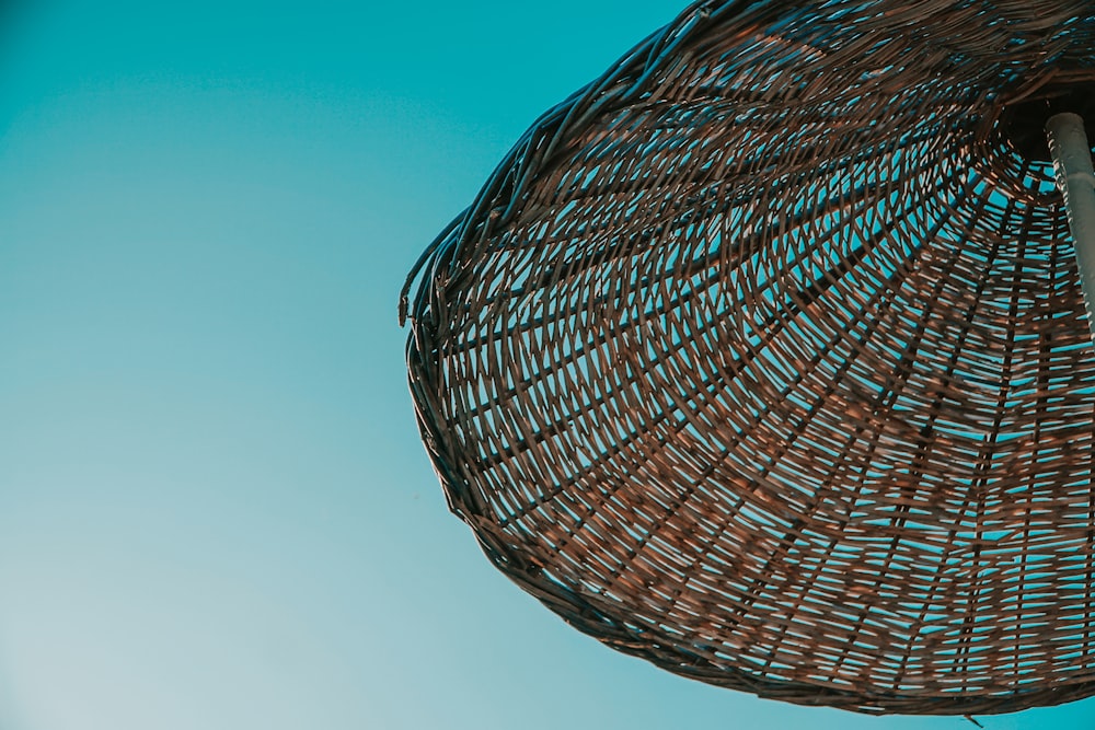 brown wicker basket under blue sky during daytime