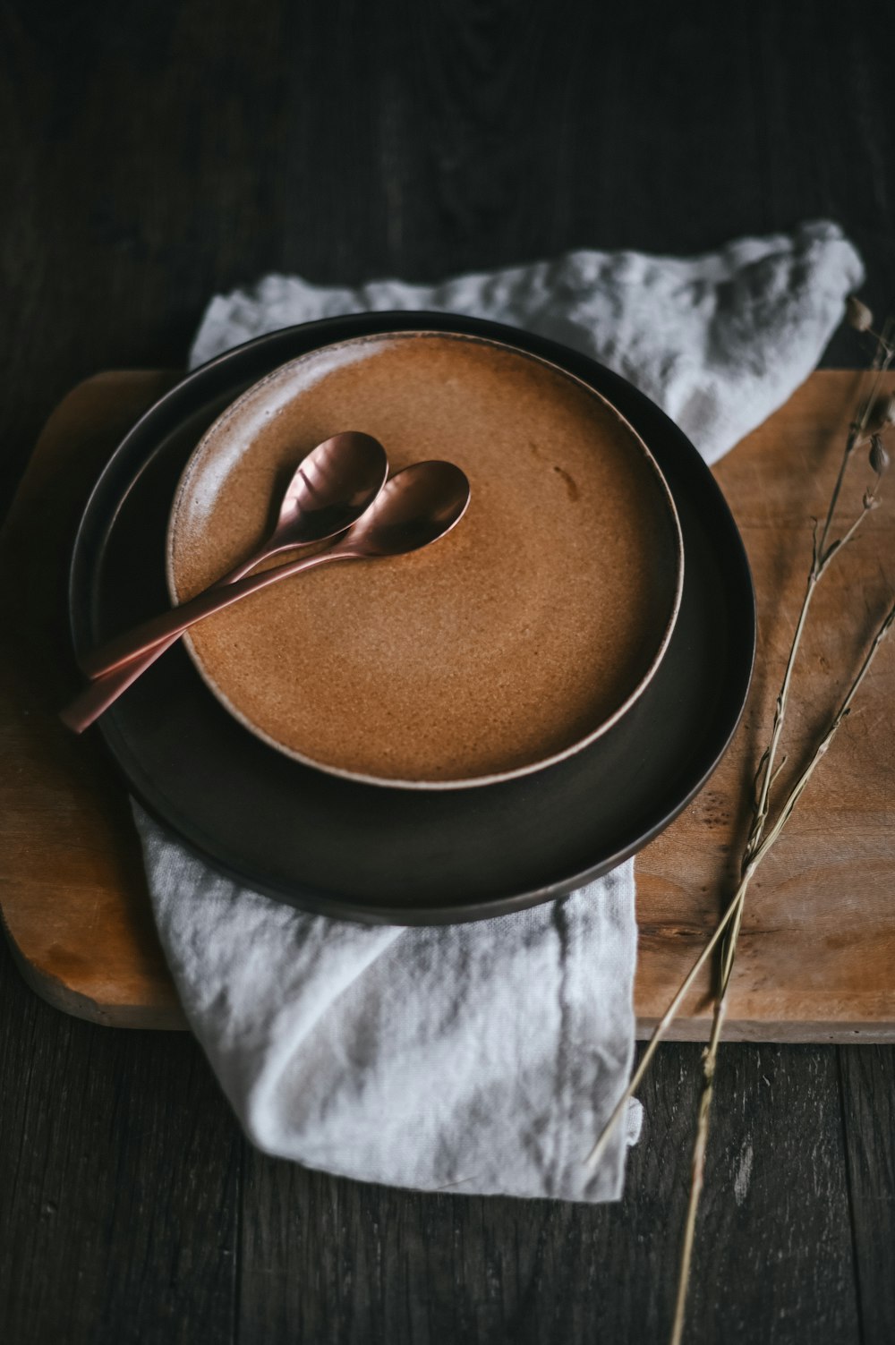 brown powder on black ceramic bowl