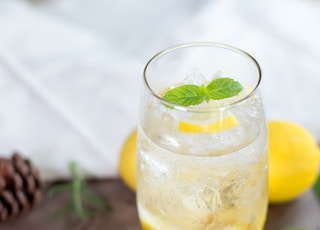 clear drinking glass with yellow liquid