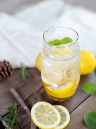 clear drinking glass with yellow liquid