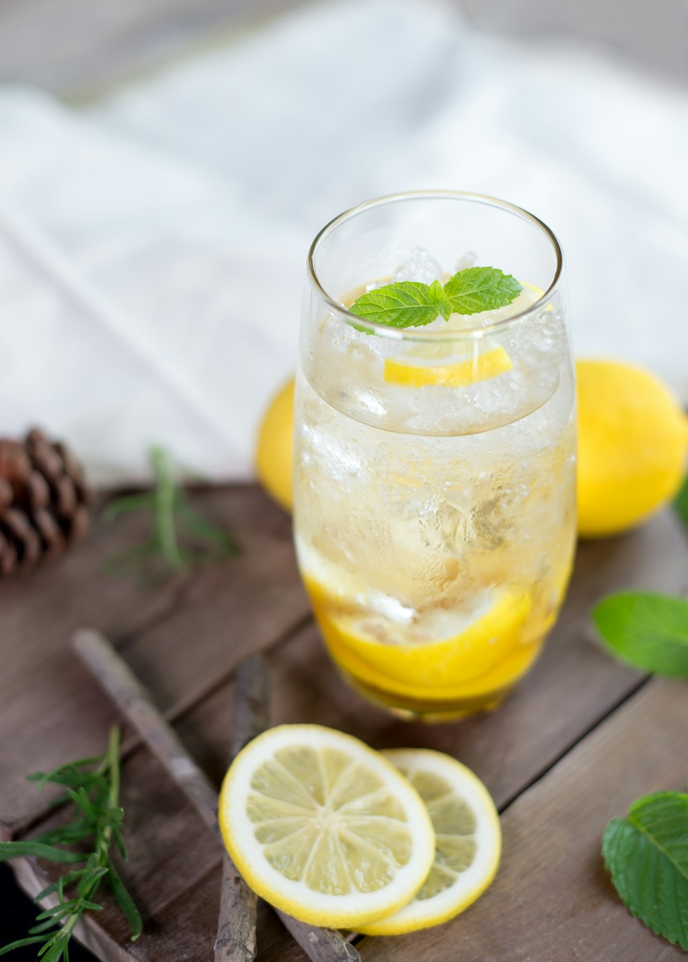 clear drinking glass with yellow liquid