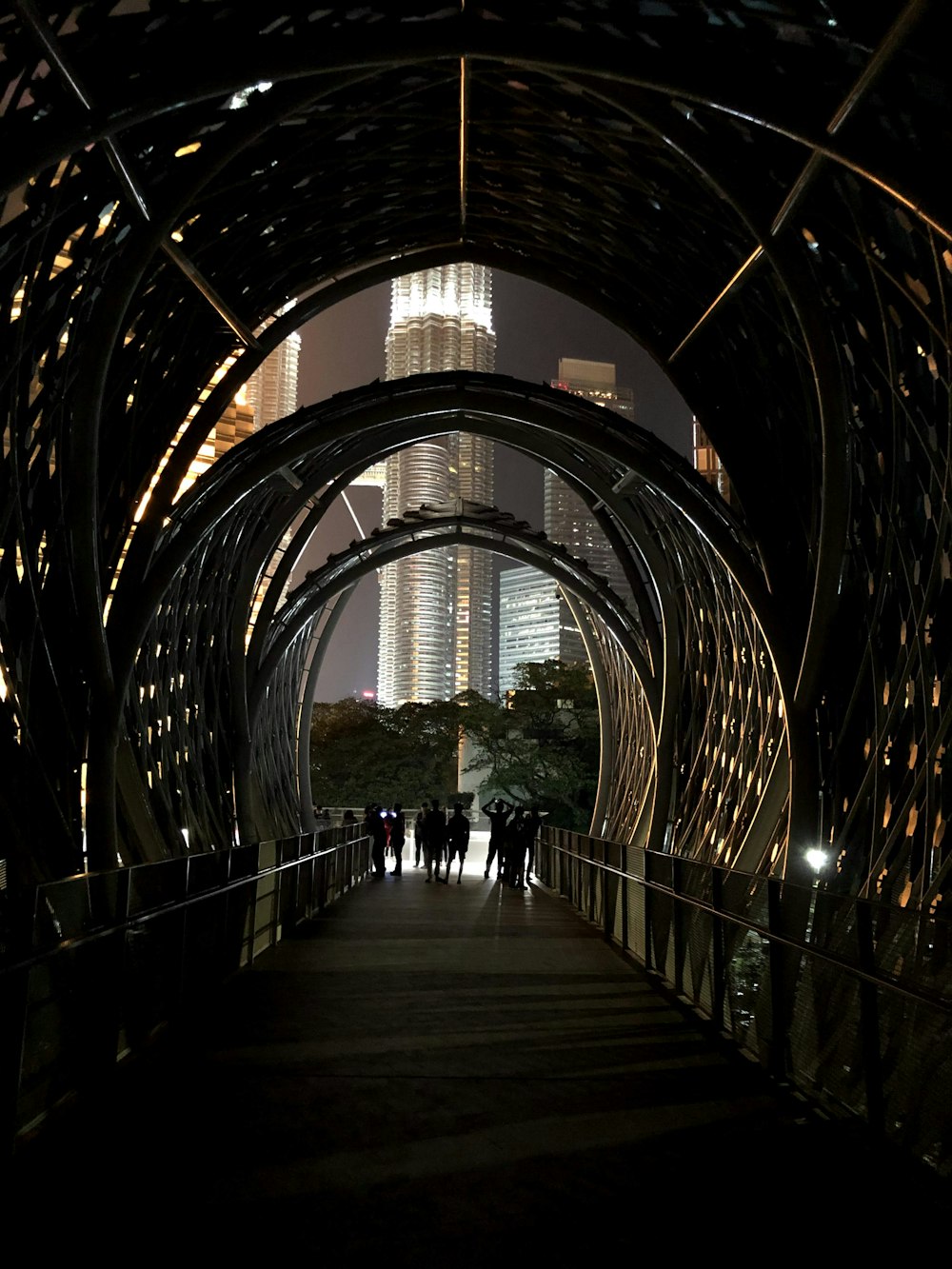 people walking on brown wooden bridge during daytime