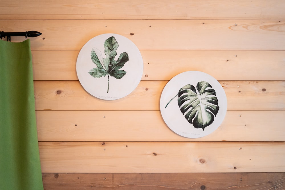 white and green floral ceramic plates