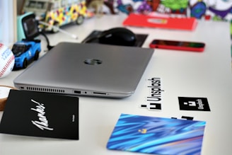 black dell laptop computer on white table