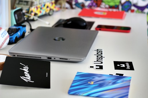 black dell laptop computer on white table