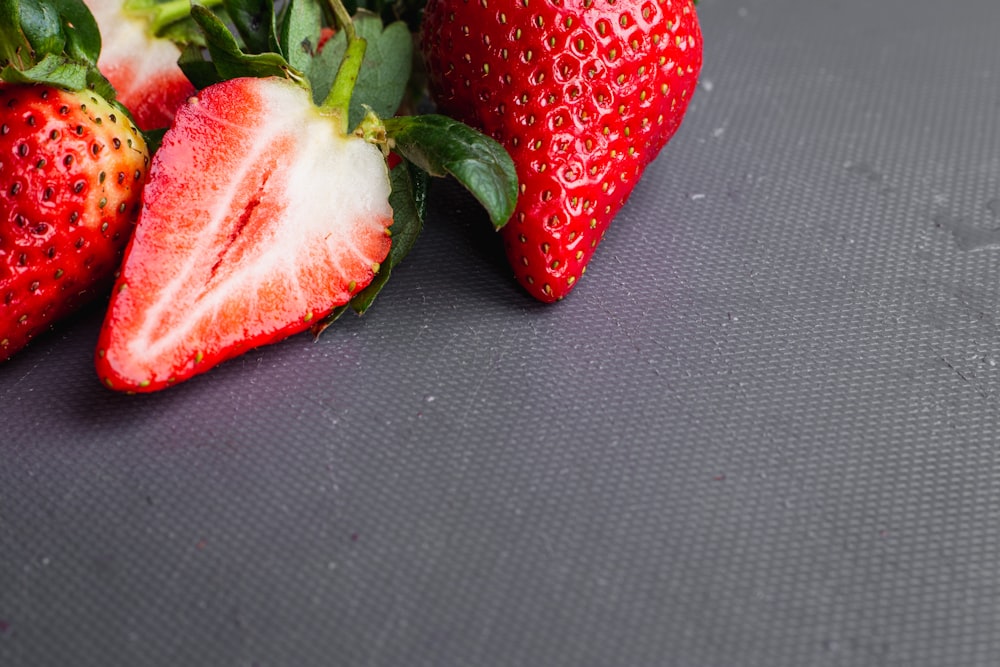 red strawberry on blue textile