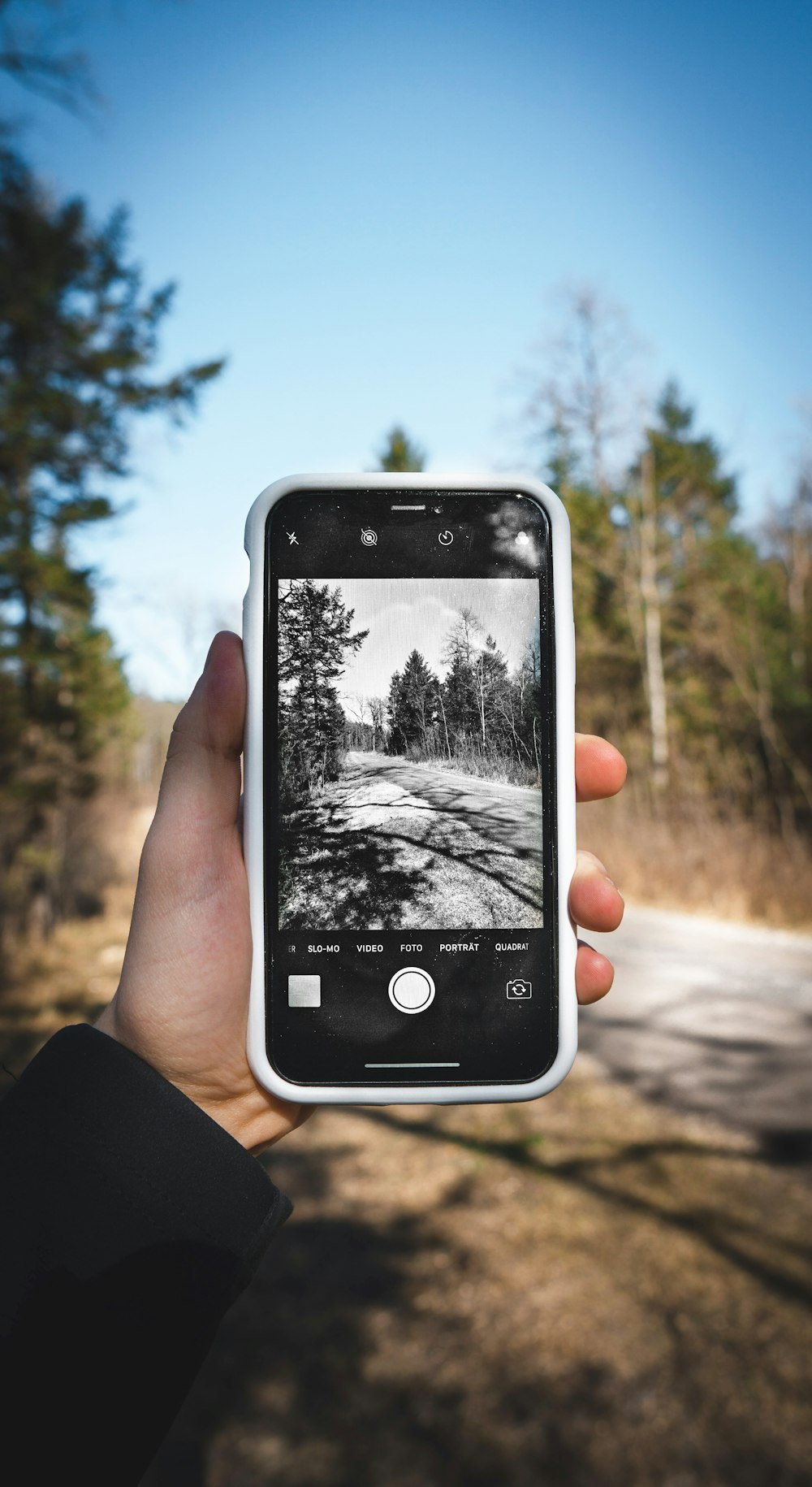 person holding black iphone 4