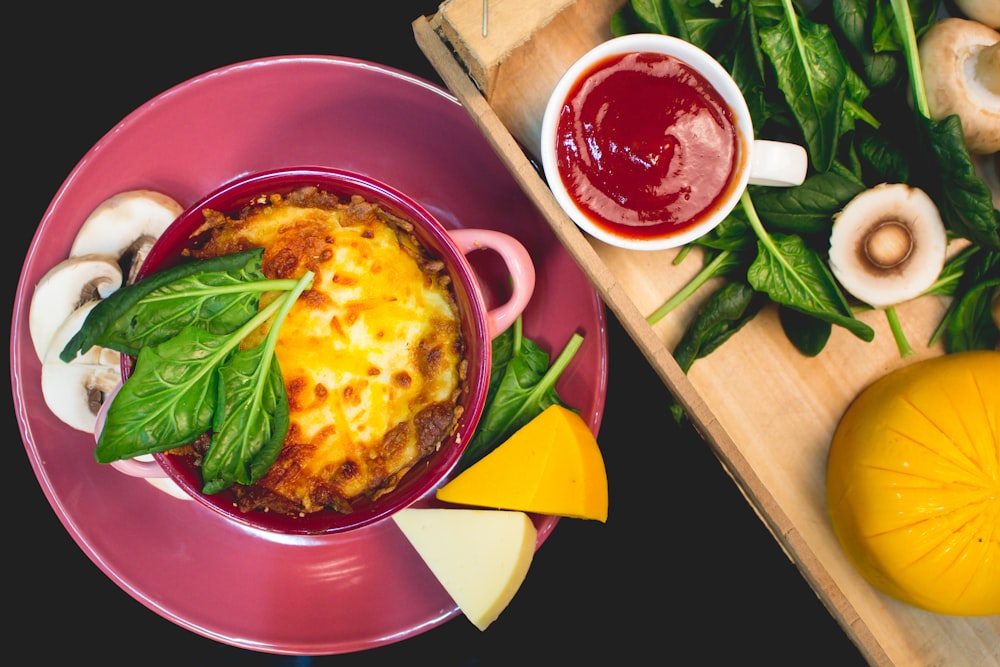 soup in red ceramic bowl