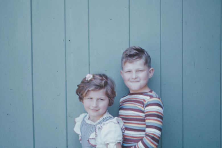 2 boys in blue and white striped long sleeve shirt