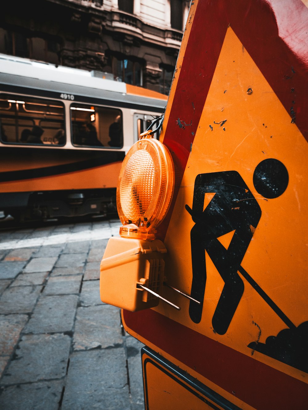 yellow and black street sign