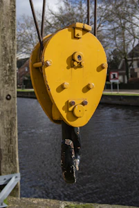 yellow heart padlock on black metal fence