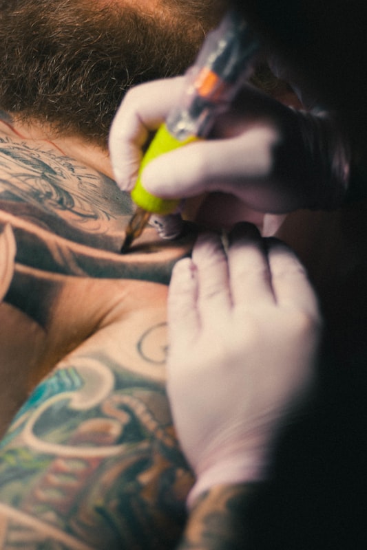 Marcus Reid, lead artist at Frith Street Tattoo, in his London studio