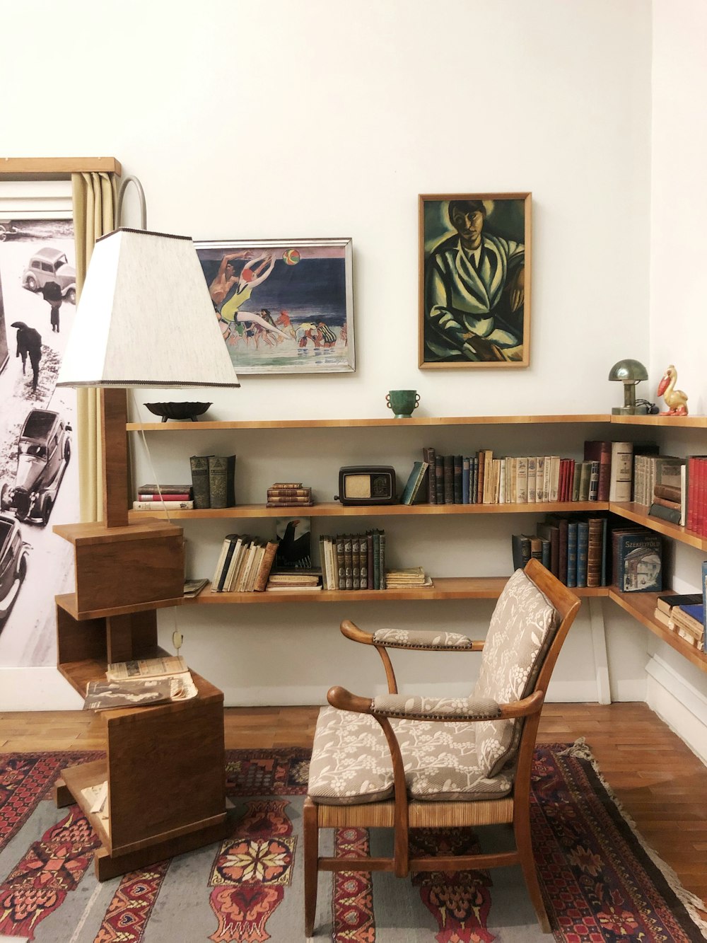 brown wicker armchair beside brown wooden book shelf