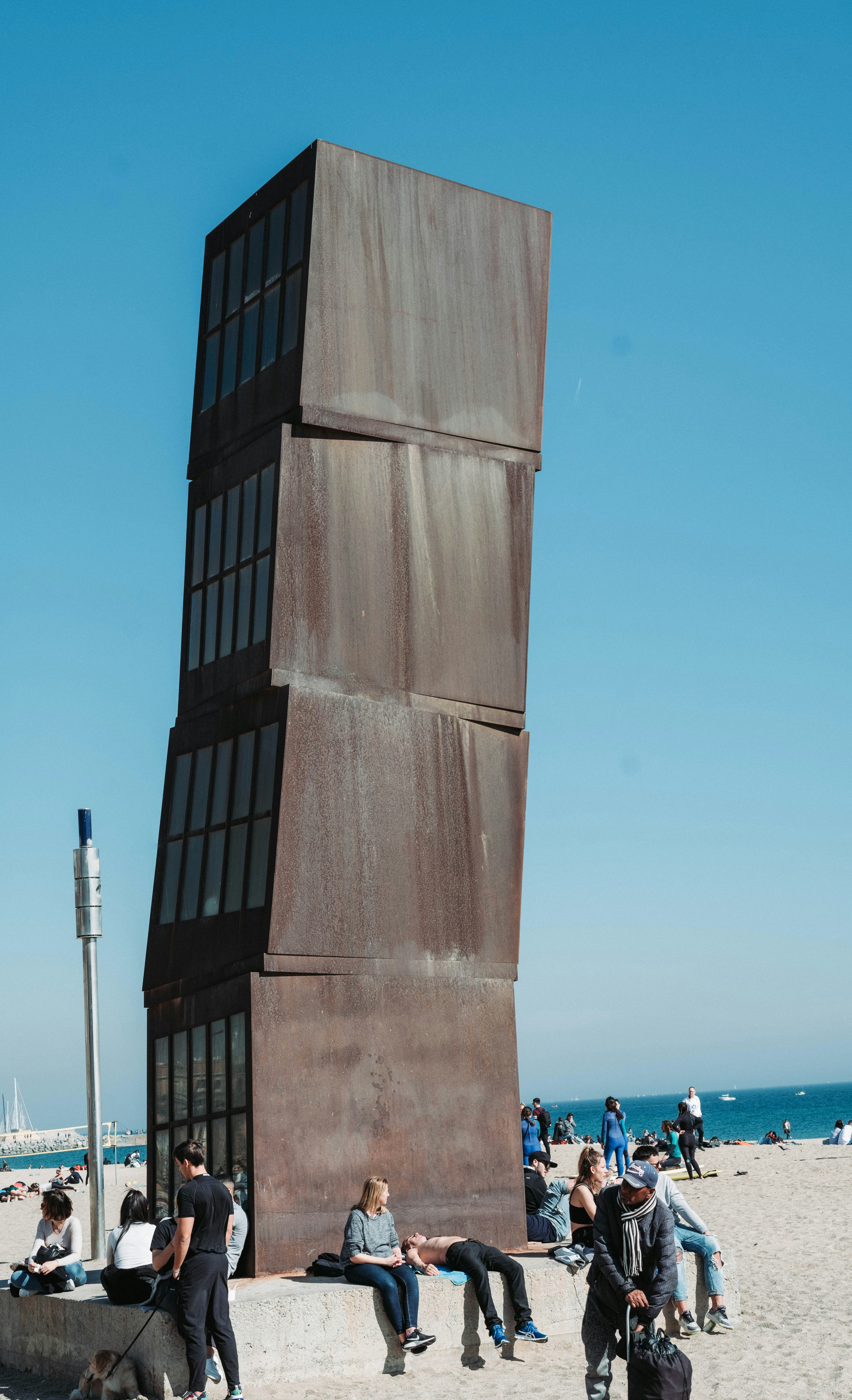 brown concrete tower near body of water during daytime