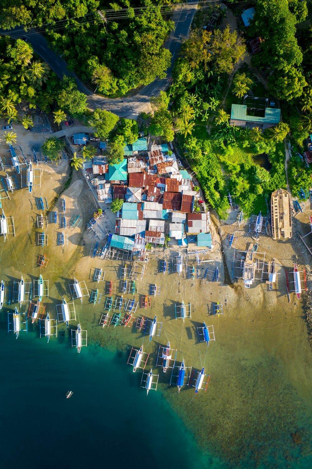 aerial view of houses near body of water during daytime