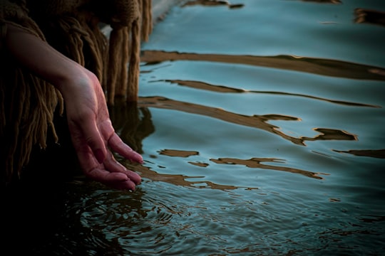 persons hand on water in Kashan Iran