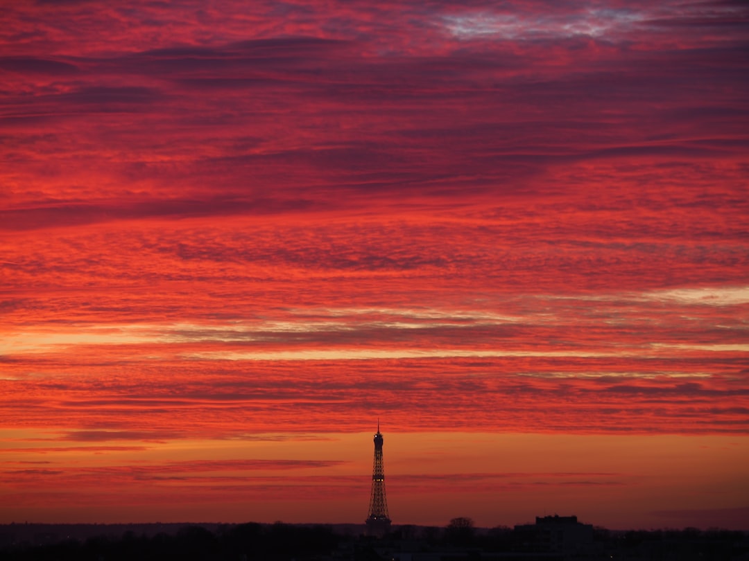 silhouette of lighthouse during sunset