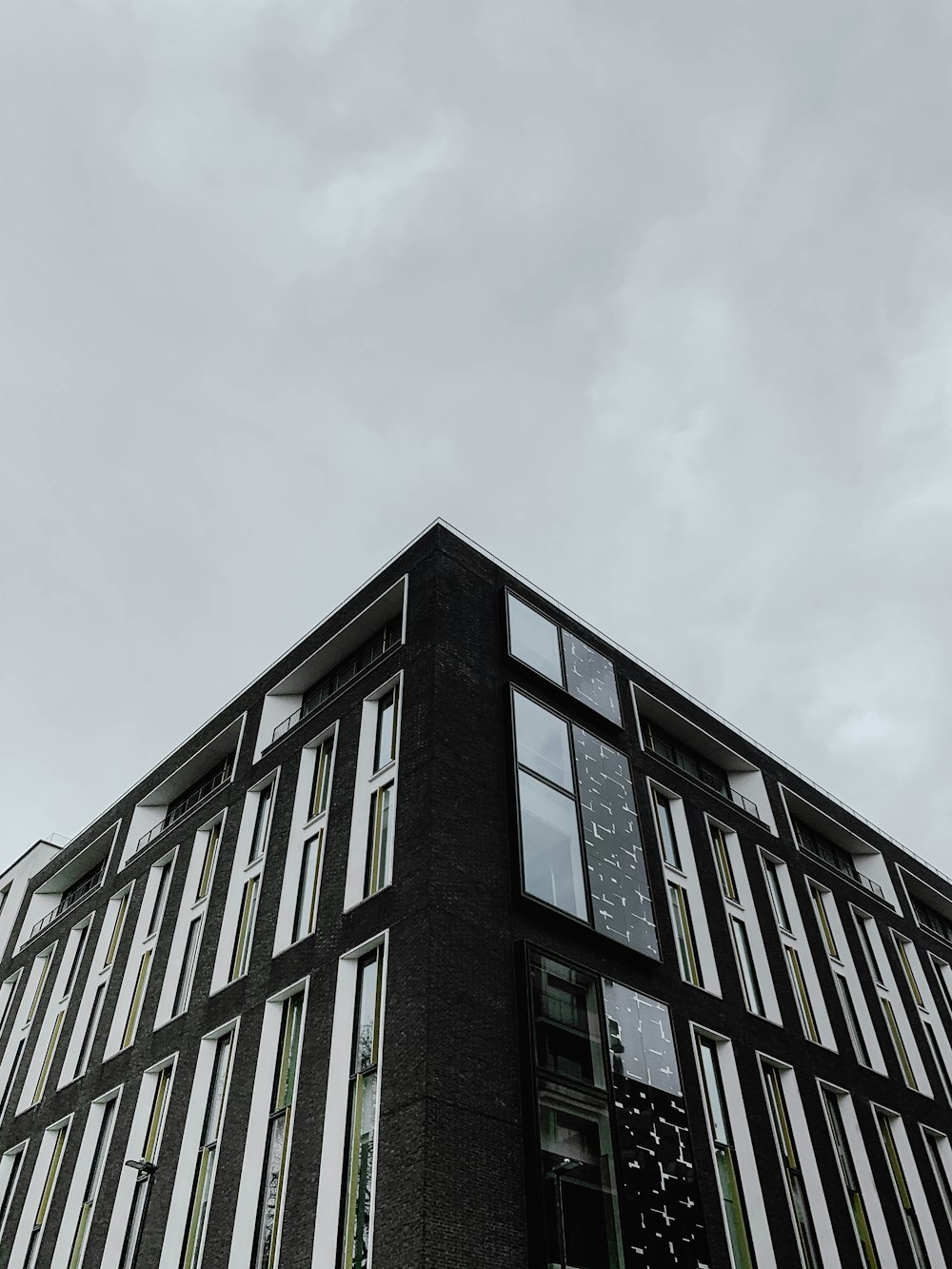 black concrete building under white sky during daytime