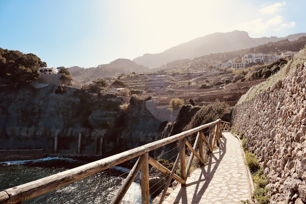 brown wooden bridge over the river