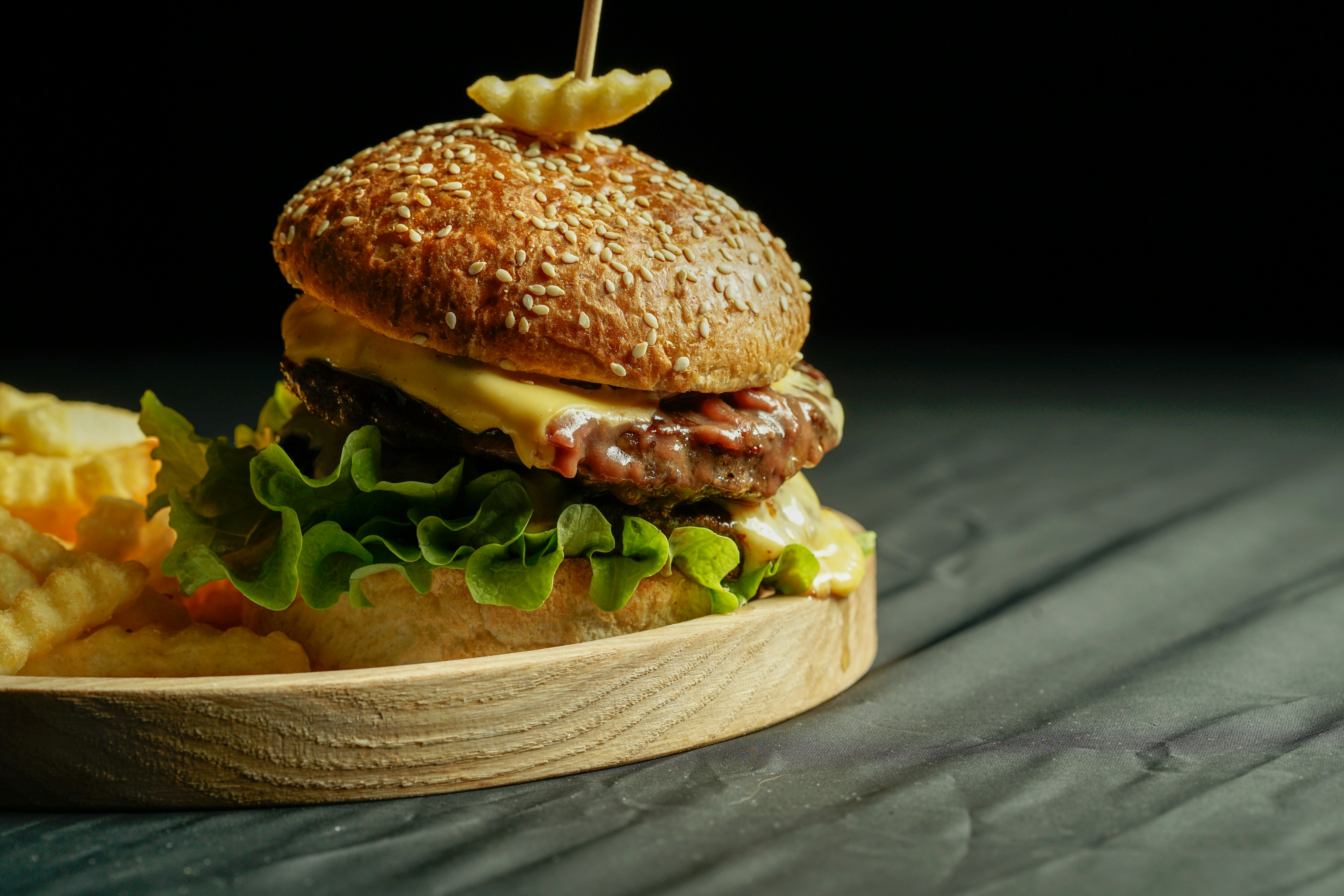 burger on brown wooden tray