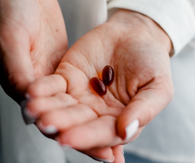 person holding brown and black round ornament