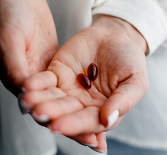 person holding brown and black round ornament