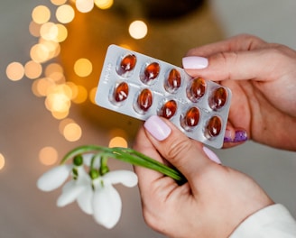 person holding silver blister pack