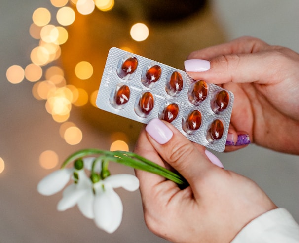 person holding silver blister pack